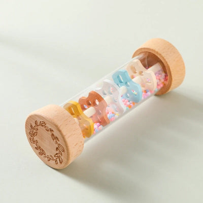Baton de pluie bébé aux couleurs fluoriscentes avec des répartiteurs de perles intégré dans un tube de son.