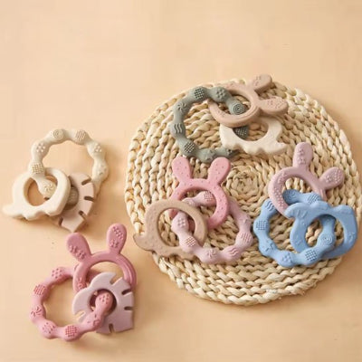 Anneau de dentition trois anneau multiformes