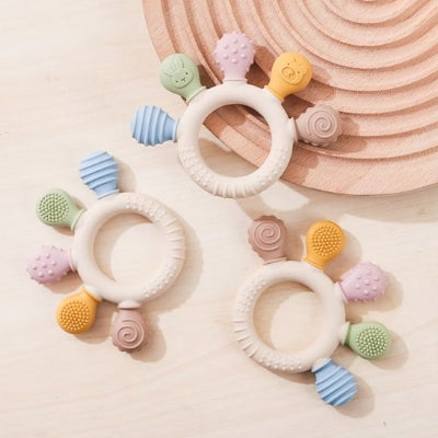 Anneau de dentition avec cinque picots