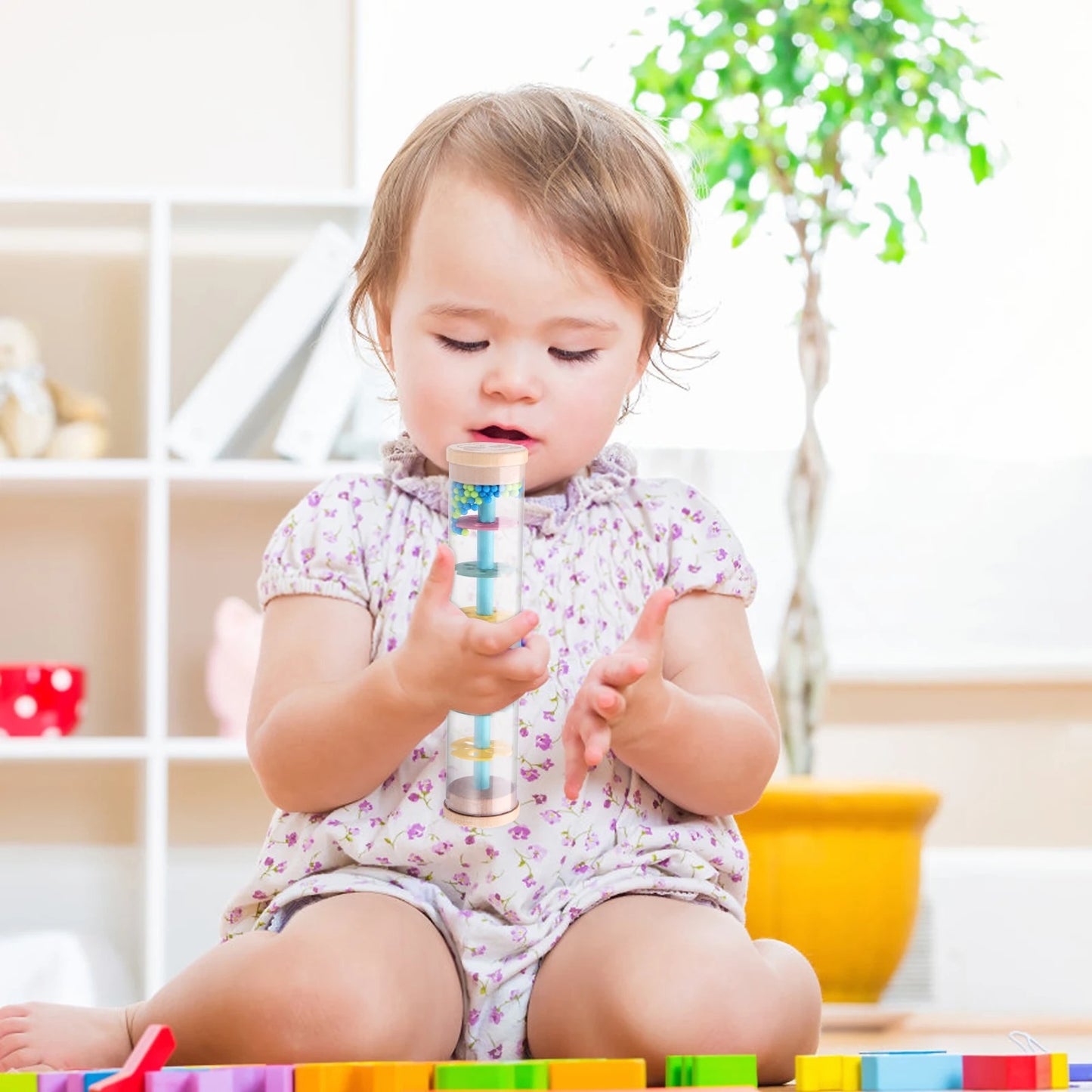 Baton de pluie bébé calme et réconforte