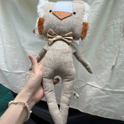doudou lion aux couleurs sobres