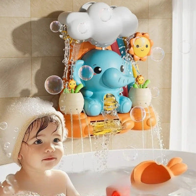La petite qui profite des instant de bonheur et d'apprentissage pendant l'hygiène avec le jouet bébé bain éléphant   