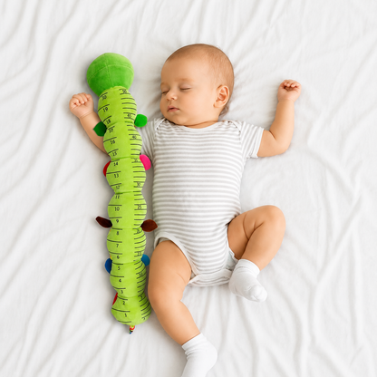 Jouet motricite bebe avec une règle de taille