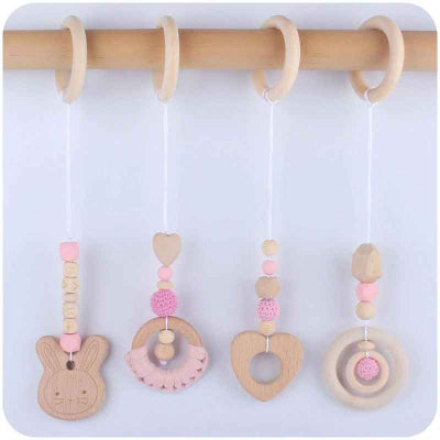 Jouet pour arche d'éveil fait de bois de hêtre et motifs rose  