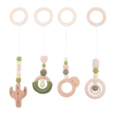 Jouet pour arche d'éveil fait de bois de hêtre et motifs vert  