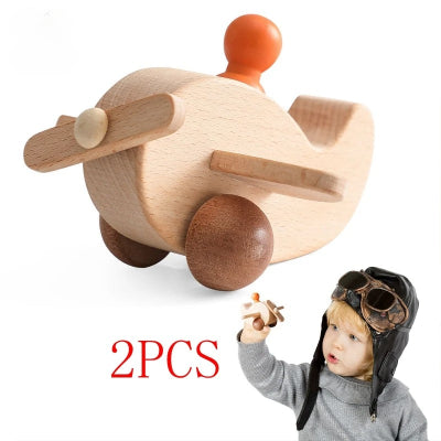 Jouets bois bebe avec le petit homme qui fait voler son avion