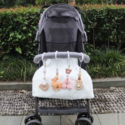 Joutes pour arche transformes en en accessoires d'éveil durant les promenades en poussette