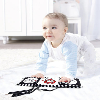Livre noir et blanc bébé crée l'intérêt de ramper