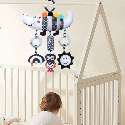 Spirale d'activité bébé accroché au dessus du berceau pour l'éveil en tout temps