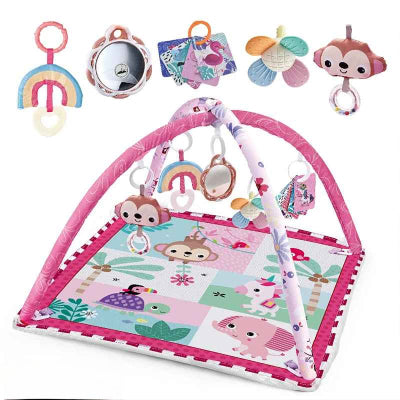 Tapis d'éveil bebe de couleur rose e avec un ensembles de hochets, miroir et livre en tissu suspendu a l'arche
